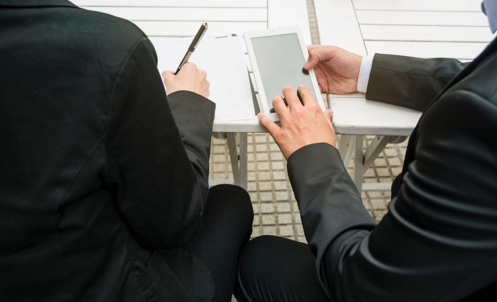Business professional reviewing statistical reports and financial projections
